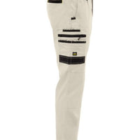 Beige pants with black zippers on a white background